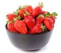 Fresh strawberries in a black cup Royalty Free Stock Photo