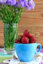 Fresh strawberries in a blue cup Royalty Free Stock Photo