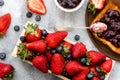 Fresh strawberries and blueberries and a slice of toast with strawberry and blueberry jam. Royalty Free Stock Photo