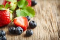 Fresh strawberries and blueberries on wooden background Royalty Free Stock Photo