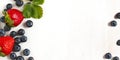 Fresh strawberries and blueberries on wooden background Royalty Free Stock Photo