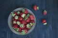 Fresh strawberries in a bowl. Dark background. View from above Royalty Free Stock Photo
