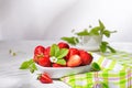 Fresh strawberries in a bowl on white stone table. Still life with selective focus Royalty Free Stock Photo