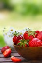 Fresh strawberries in a bowl on wooden table Royalty Free Stock Photo