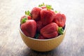 Fresh strawberries in a bowl on a wooden table. Fresh strawberries in a bowl on a wooden table. Vegetarianism, vegan