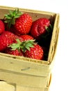 Fresh strawberries in a chip basket against a white background Royalty Free Stock Photo