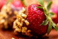 Fresh strawberries covered with dark chocolate and nuts Royalty Free Stock Photo