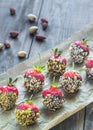 Fresh strawberries covered with dark chocolate and nuts Royalty Free Stock Photo