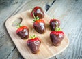 Fresh strawberries covered with dark chocolate Royalty Free Stock Photo