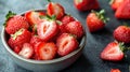 Fresh strawberries cut in half arranged in a bowl Royalty Free Stock Photo