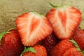 Fresh strawberries and a cut one Royalty Free Stock Photo