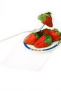 Fresh strawberries dish over white