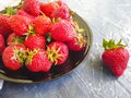 Fresh strawberries freshness appetizing vitamin in a plate delicious on a concrete background