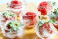 Fresh strawberries frozen in ice cubes, close-up Royalty Free Stock Photo