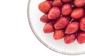 Fresh strawberries in a glass bowl isolated Royalty Free Stock Photo