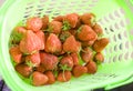 Fresh strawberries in the green basket