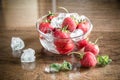 Fresh strawberries with ice cubes in the glass bowl Royalty Free Stock Photo