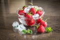 Fresh strawberries with ice cubes in the glass bowl Royalty Free Stock Photo