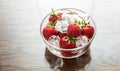 Fresh strawberries with ice cubes in the glass bowl Royalty Free Stock Photo