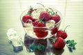 Fresh strawberries with ice cubes in the glass bowl Royalty Free Stock Photo