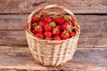 Fresh strawberries with leaves in basket. Royalty Free Stock Photo