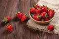 Fresh strawberries on an old wooden surface. Royalty Free Stock Photo