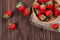 Fresh strawberries on an old wooden surface. Royalty Free Stock Photo