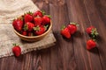 Fresh strawberries on an old wooden surface. a bunch of ripe strawberries Royalty Free Stock Photo