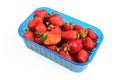 Fresh strawberries in plastic container isolated on white background