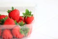 Fresh strawberries in a plastic container