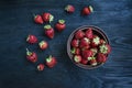 Fresh strawberries in a plate on a dark wooden background Royalty Free Stock Photo