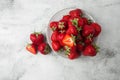 Fresh strawberries in plate on marble white table. Fresh nice strawberries. Strawberry field on fruit farm. Heap of Red strewberry Royalty Free Stock Photo