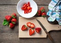 Fresh strawberries, sliced, knife