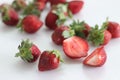 Fresh strawberries. Small and big. Pink red and green combination