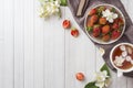 Fresh strawberries and tea with Jasmine flowers on a light background. Summer concept. Copy space Royalty Free Stock Photo