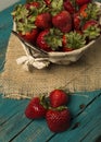 Fresh strawberries on turquoise background