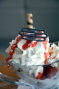 Fresh strawberries and vanilla ice cream with whipped cream on a glass bowl. Royalty Free Stock Photo