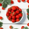 Fresh strawberries in a white porcelain bowl on wooden table in Royalty Free Stock Photo