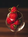 Fresh strawberries in wine glass on table. Ripe strawberry closeup. Sweet summer harvest. Juicy dessert. Healthy food. Red berries Royalty Free Stock Photo