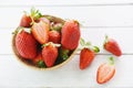 Fresh strawberries on wooden background - ripe red strawberry picking in basket Royalty Free Stock Photo