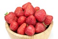 Fresh strawberries in wooden bowl isolated on white background. Royalty Free Stock Photo