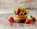 Fresh strawberries in a wooden bowl, selective focus Royalty Free Stock Photo