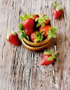 Fresh strawberries in a wooden bowl, selective focus Royalty Free Stock Photo