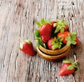 Fresh strawberries in a wooden bowl, selective focus Royalty Free Stock Photo