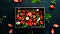 Fresh strawberries in a wooden box. Berries Top view. Royalty Free Stock Photo