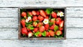 Fresh strawberries in a wooden box. Berries Top view. Royalty Free Stock Photo