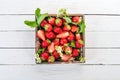 Fresh strawberries in a wooden box. Royalty Free Stock Photo