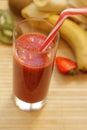 Fresh strawberry-banana smoothie with the addition of kiwi in a glass Royalty Free Stock Photo