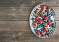 Fresh strawberry and blueberry mix on a metal dish (tray) over a Royalty Free Stock Photo