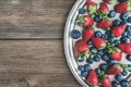 Fresh strawberry and blueberry mix on a metal dish (tray) over a Royalty Free Stock Photo